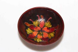 Moorcroft Pottery flambé footed dish decorated with columbine, 14cm diameter.