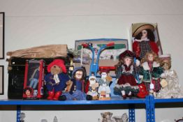 Child's tricycle, tin trunk, Paddington Bear, various dolls, kites, etc.