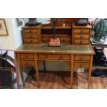 Edwardian mahogany and floral inlaid writing desk, the raised galleried back having eight drawers,