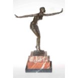 Art Deco bronze lady figure in a dancing pose on a marble plinth, 47cm.