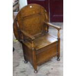 Early 20th Century carved oak monks chair.