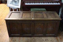 Jointed oak four panel front coffer, 59cm by 138.5cm.
