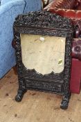 Chinese carved hardwood table mirror, 107cm by 59cm.