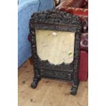 Chinese carved hardwood table mirror, 107cm by 59cm.