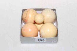 Four antique ivory snooker balls and two small balls (6).