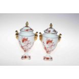 Pair of Coalport 'Indian Tree Coral' lidded vases with gilt rams head handles.