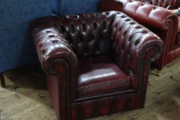 Deep buttoned ok blood leather Chesterfield chair.