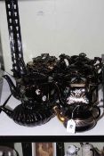 Nine Victorian black glazed teapots.