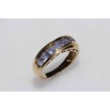 14 carat yellow gold and amethyst row ring, size P.