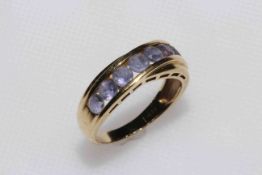 14 carat yellow gold and amethyst row ring, size P.