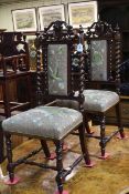 Pair floral needlework seated and panel back side chairs with twist supports.
