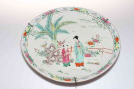 Antique Japanese porcelain charger, painted and enamelled with figures in garden, 40cm diameter.