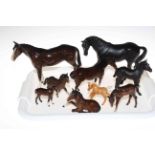Collection of nine Beswick horses and foals.