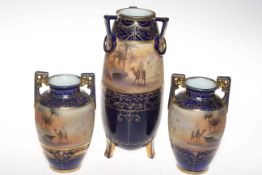 Noritake set of three vases with band of desert scenes, largest 25cm.