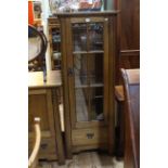 Sherry medium oak slim illuminated display cabinet in Arts & crafts style having two glass shelves