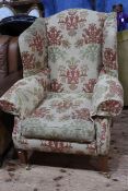 Duresta wing armchair in classical floral fabric.