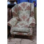 Duresta wing armchair in classical floral fabric.