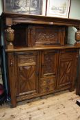 Large carved oak buffet sideboard having four doors and two drawers and carved supports,