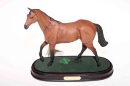 Beswick model of Red Rum on wood plinth with box.