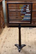 Vintage abacus on pitch pine and cast triform base bearing label The North of England School