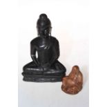 Two antique carved hardwood Buddha's, 18cm and 6cm.