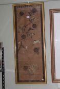 Chinese woven silk panel decorated with birds and tree blossom in gilt glazed frame,