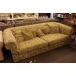 Chesterfield settee in swag decorated fabric.
