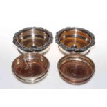 Pair Sheffield plated wine bottle coasters, wooden base with central silver inset,