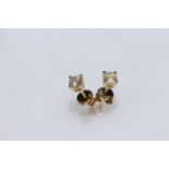 Pair 14 carat gold, diamond stud earrings, with gemological certificate.