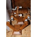 Three Yorkshire carved oak twin wall lights and a Martin 'Lizardman' Dutton carved oak table lamp