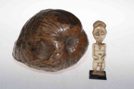 Antique tribal art ivory figure and large nut (2).