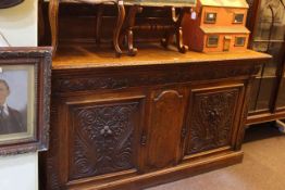 Late Victorian carved oak two door sideboard with raised back, 130.5cm by 182cm.