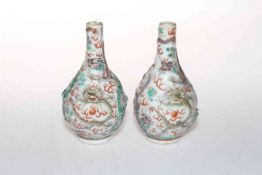 Pair antique Chinese vases, the bodies with relief dragons and painted bats, blue vases, 13cm.