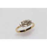 18 carat gold and diamond cluster ring set with baguettes and brilliants, size N.