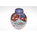 Chinese style ginger jar decorated with dragons and floral panels.