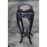 Oriental circular carved hardwood and marble inset top jardiniere stand, 91cm by 28cm diameter.