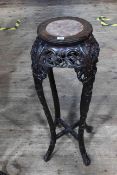 Oriental circular carved hardwood and marble inset top jardiniere stand, 91cm by 28cm diameter.