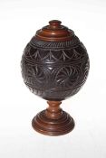 Carved coconut shell box with turned treen lid and base.