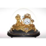 Highly ornate gilt metal mantel clock mounted with wing cherub,