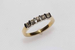 18 carat gold and five stone diamond ring, size M.