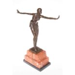 Art Deco bronze lady figure in a dancing pose on marble plinth, 56cm high.