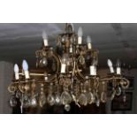 Fifteen branch two tier gilt metal chandelier with crystal glass drops.