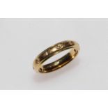 18 carat gold and diamond set band ring, size N.