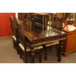 Rectangular hardwood dining table and four rail back chairs.