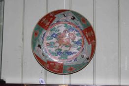 Antique Japanese charger, decorated with centre beast and flying storks on red,