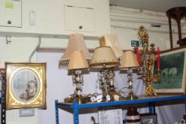 Collection of five table lamps, gilt candle holder and three gilt framed pictures.