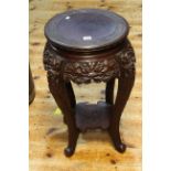 Carved Oriental hardwood jardiniere stand, 60cm by 36cm diameter.