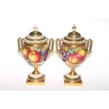 Pair Royal Worcester Freeman fruit painted two handle urn vases and covers, having mask handles,