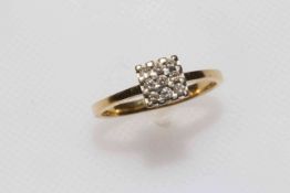 18 carat gold and nine stone diamond ring, size M/N.