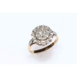 Diamond three tier cluster ring set in 18 carat gold, size N.